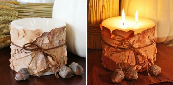 DIY birch bark candle holder wrapped with twine and decorated with acorns for rustic Thanksgiving décor.