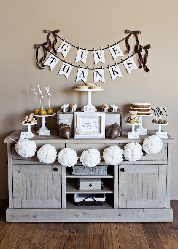 DIY Thanksgiving dessert buffet with free printable decorations, a Give Thanks banner, and rustic fall table decor.