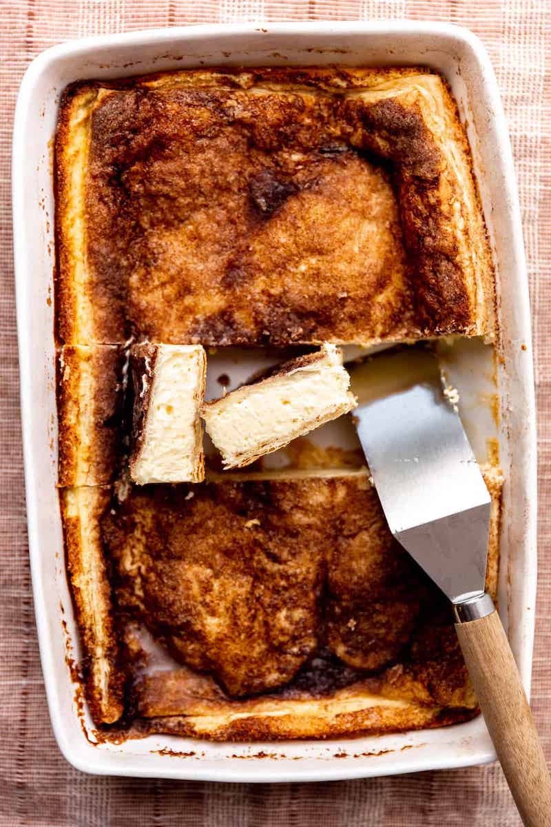 Sopapilla sheet cheesecake with a bottom layer of puff pastry , sweet, smooth cheesecake filling, and another layer of pastry on top.