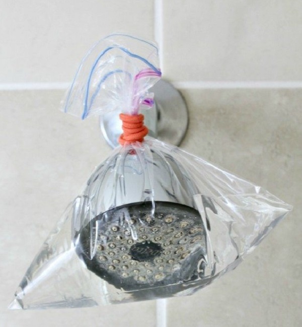 Soak your shower head. 17 Brilliant All-Natural Bathroom Cleaning Hacks