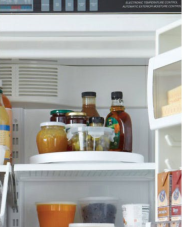 Use a Lazy Susan - or 2 - Amazing Fridge Hacks That'll Change Your Kitchen