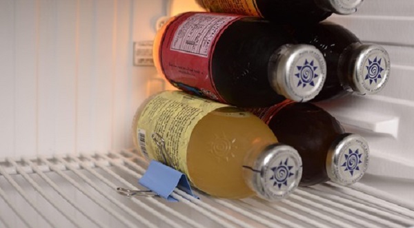 Binder Clip Hack Keep Bottles in Place with a Binder Clip 10 Must-Try Refrigerator Organization Hacks
