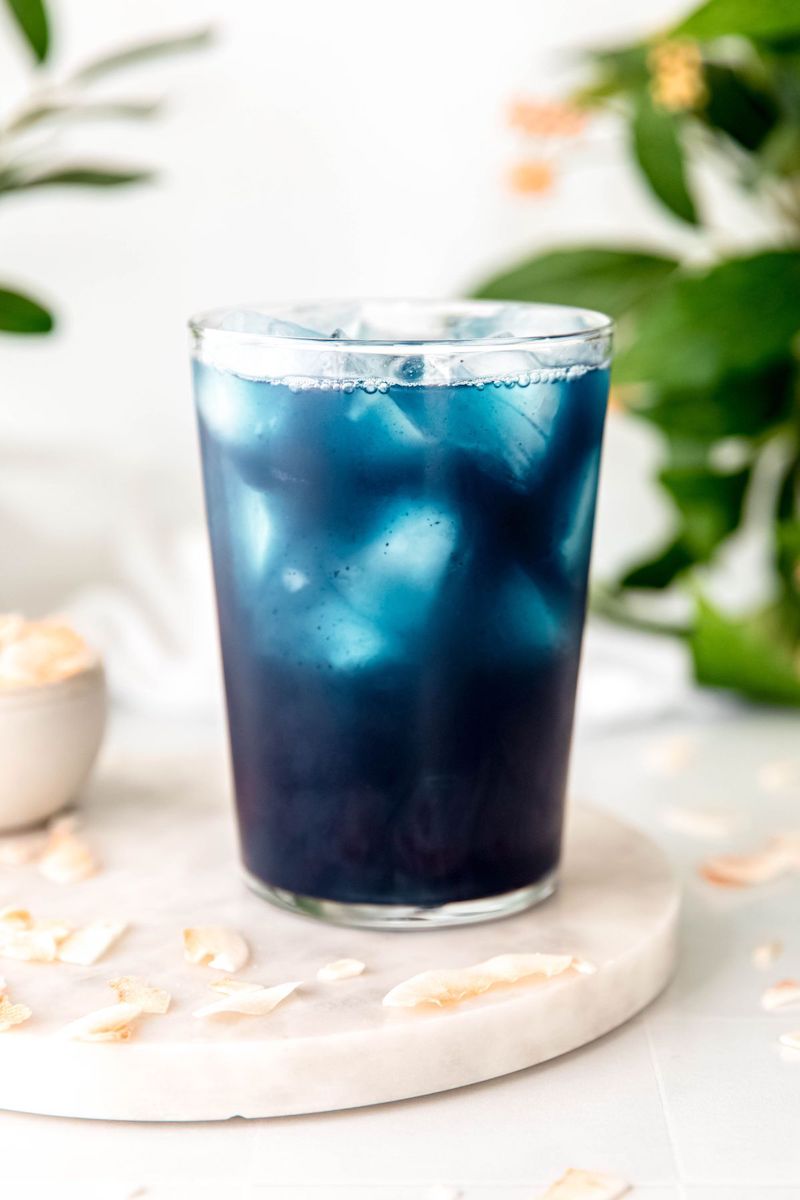 A Starbucks copycat Blue Coconut Refresher with a vibrant blue color served over ice.