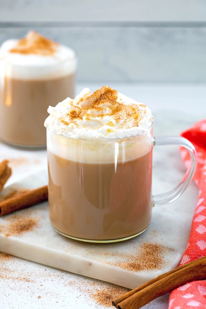 Starbucks copycat cinnamon dolce latte topped with whipped cream and cinnamon sugar.