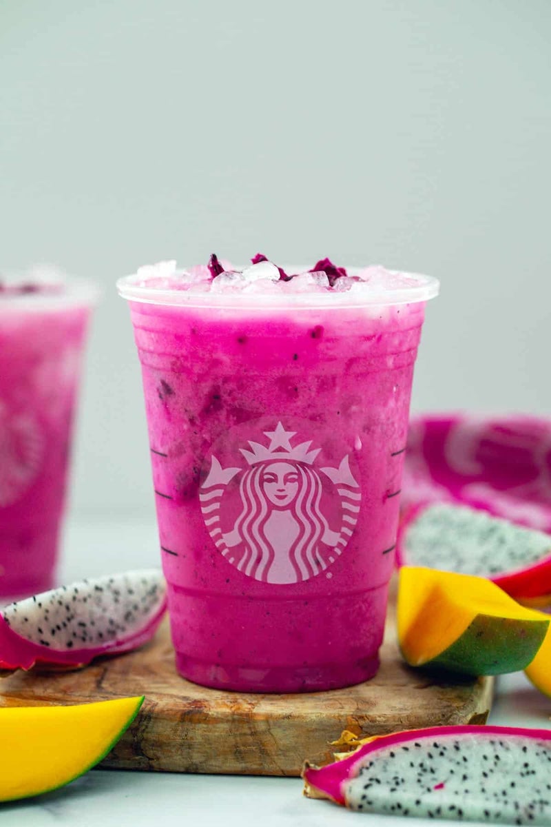 A Starbucks copycat Dragon Drink made with creamy coconut milk, mango dragonfruit refresher base, and freeze-dried dragon fruit over ice.