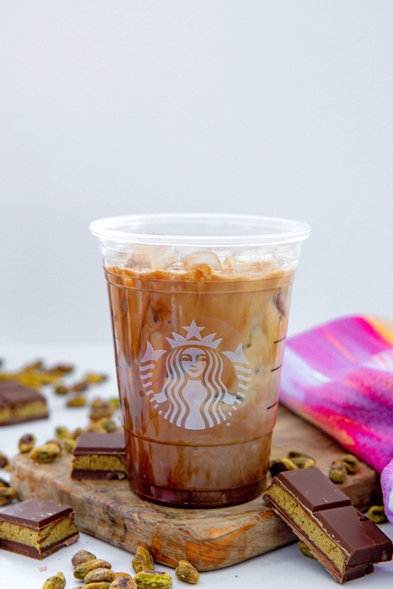 Starbucks copycat Dubai chocolate mocha with pistachio cold foam served over ice.