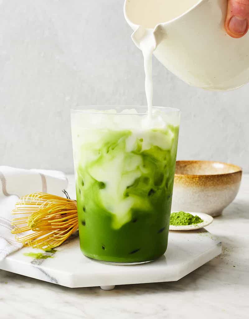A creamy iced matcha latte made with vibrant green matcha, milk, and ice.