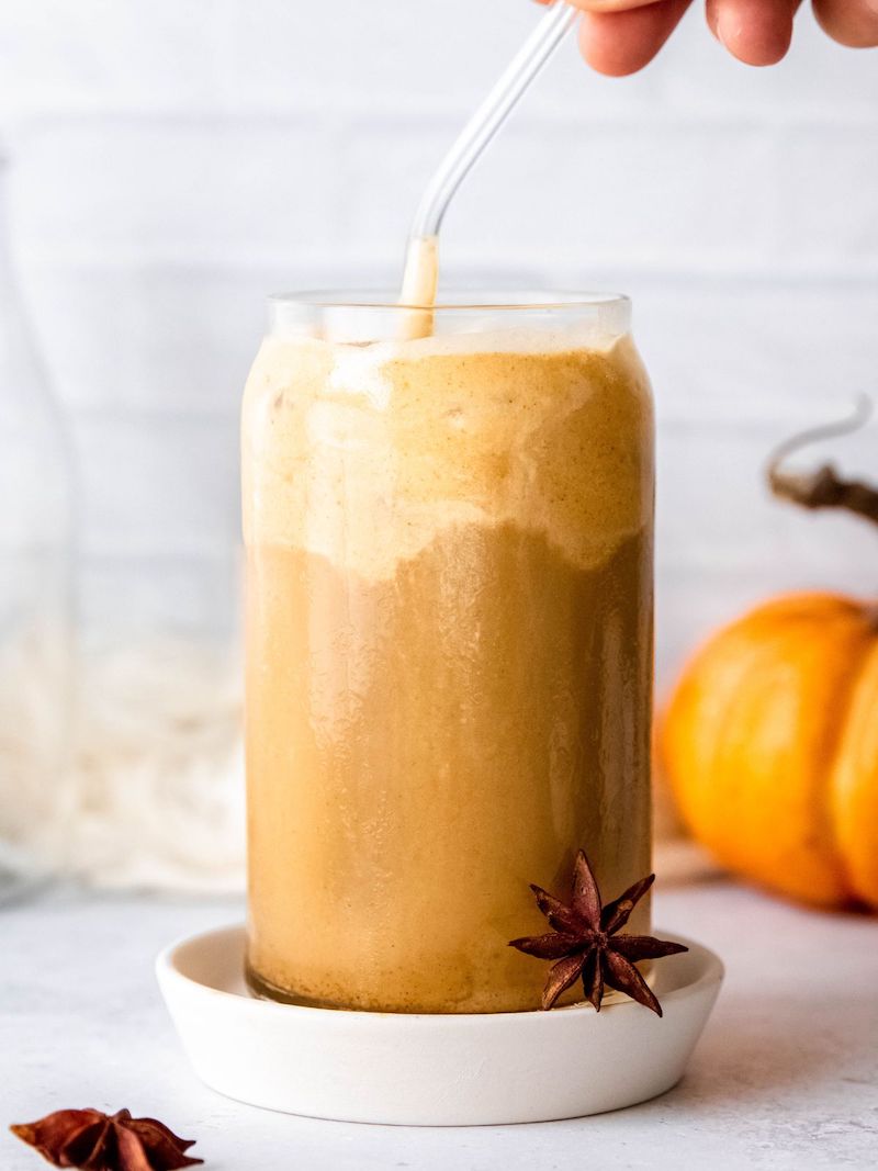 Starbucks Pumpkin Cream Cold Brew topped with creamy pumpkin cold foam and pumpkin pie spice in a clear glass over ice.
