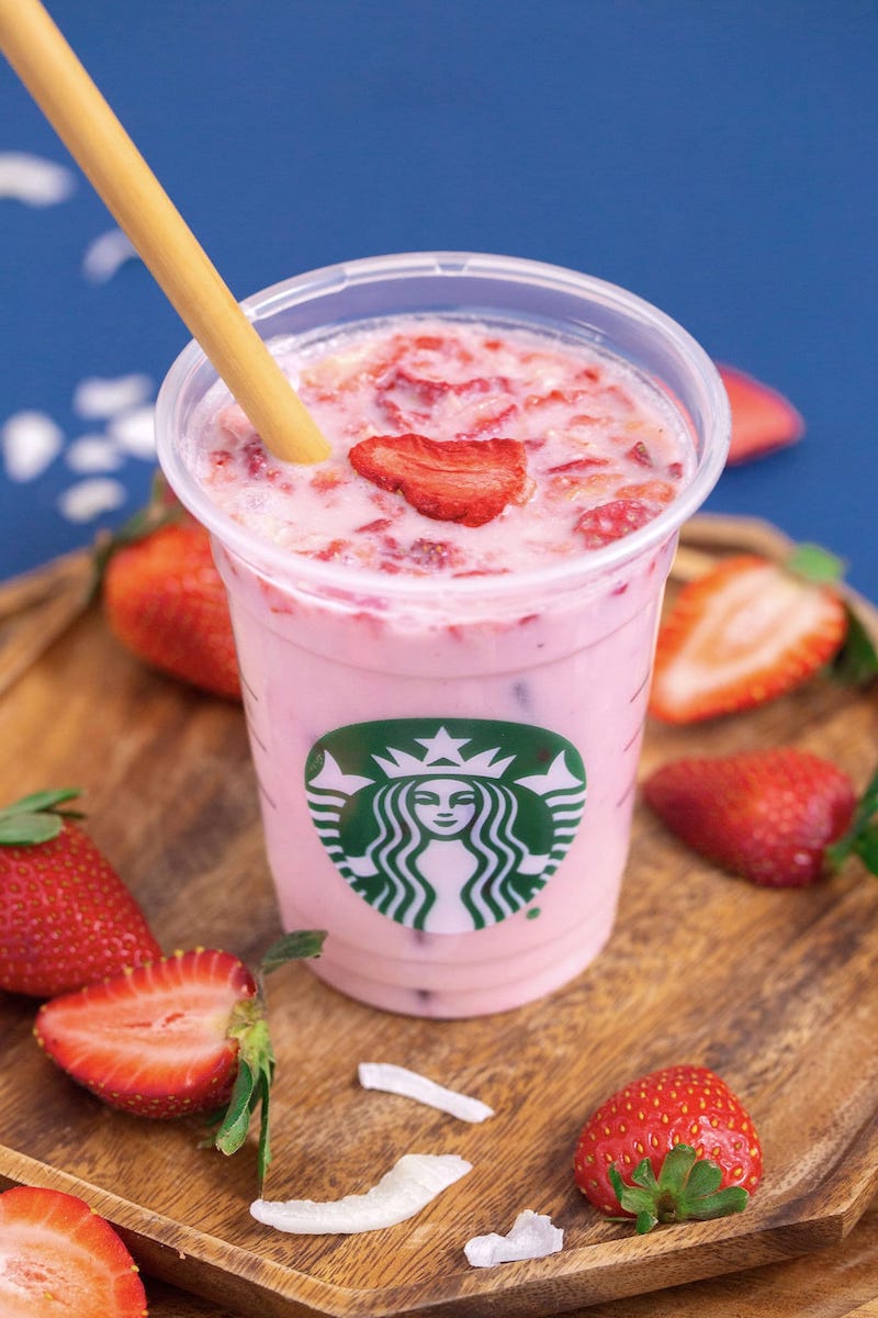 A Starbucks copycat Pink Drink made with creamy coconut milk, strawberries, açaí, and freeze-dried strawberries over ice.