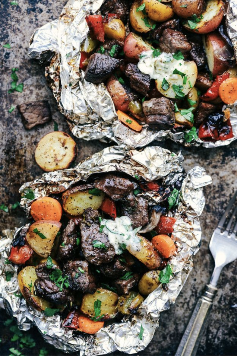Butter herb steak foil packet with vegetables.