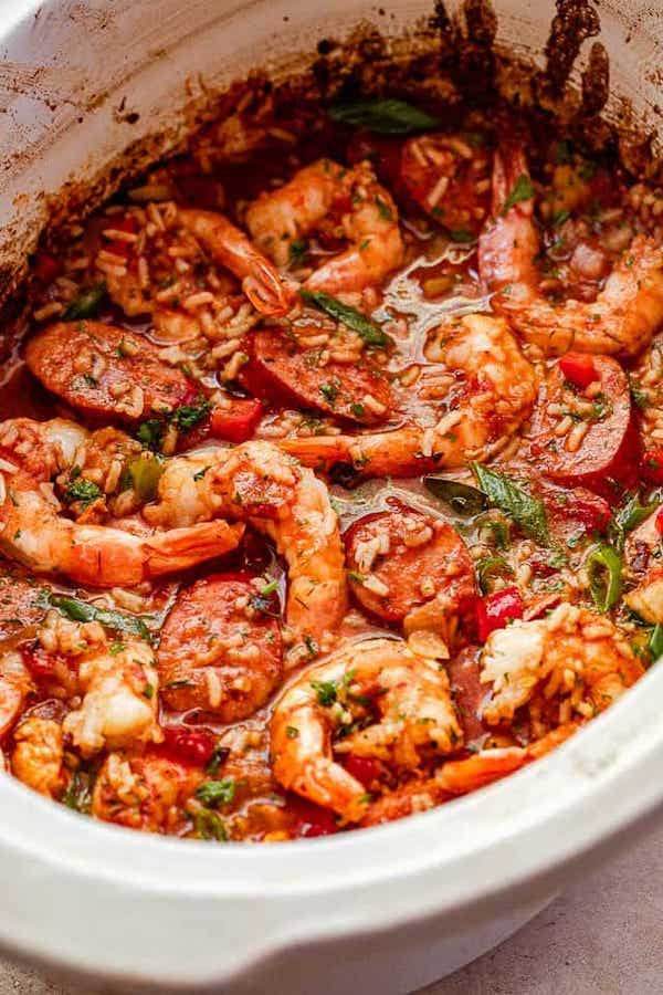 Overhead shot of slow cooker jambalaya in the Crockpot loaded with shrimp, sausage, and vegetables.