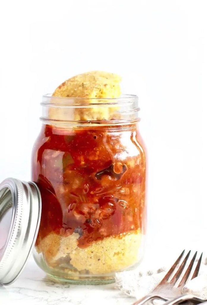 Veggie chili and cornbread served in mason jars for grab-and-go convenience.