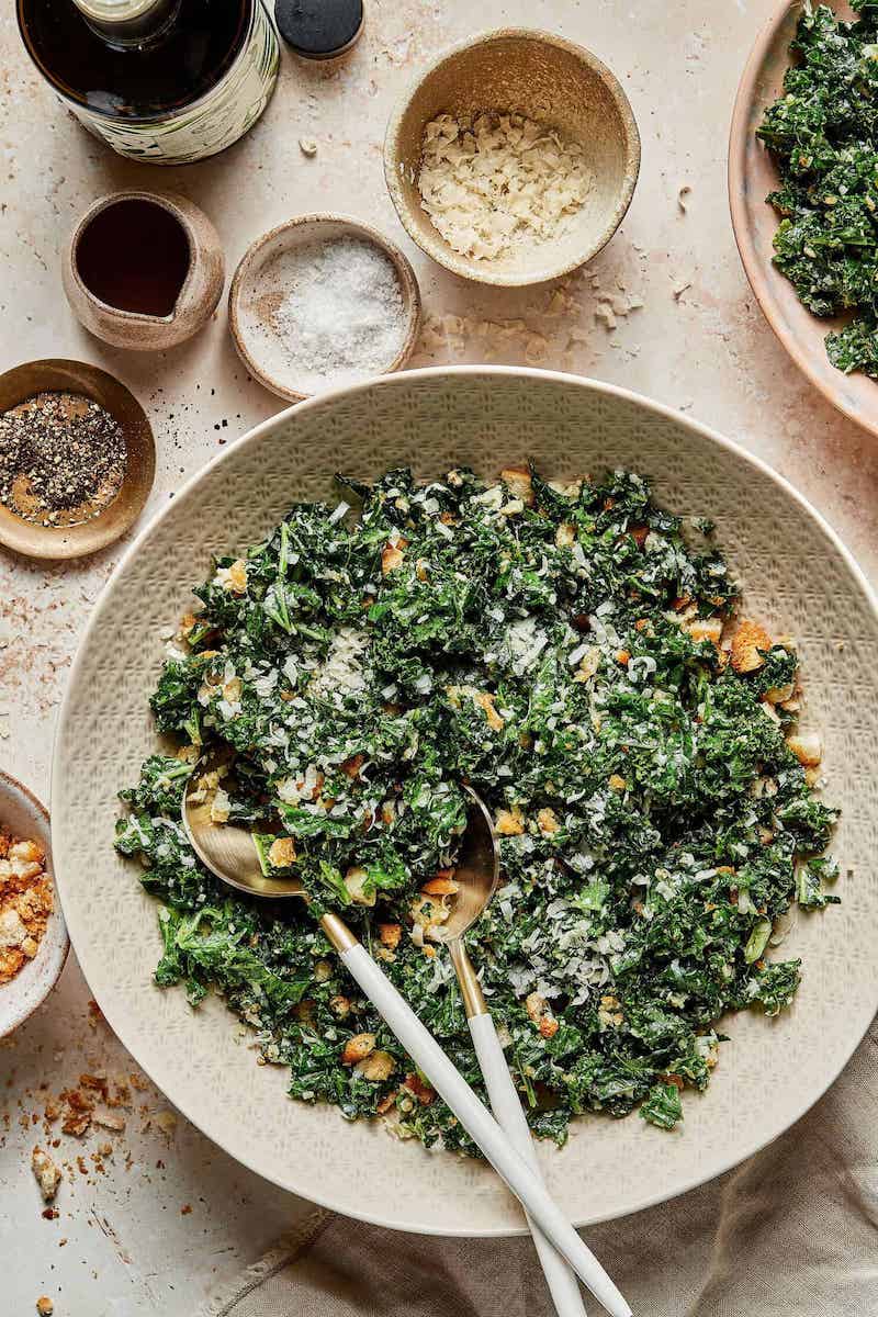 Lemony Parmesan Kale Salad with tender massaged kale, grated Parmesan, crunchy croutons, and a fresh lemon-garlic dressing served in a large bowl.