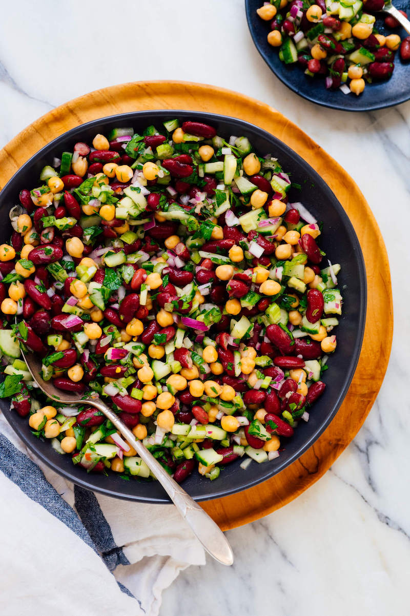Mediterranean bean salad made with kidney beans, chickpeas, cucumber, celery, red onion, parsley, and fresh herbs tossed in a zesty lemon garlic dressing.